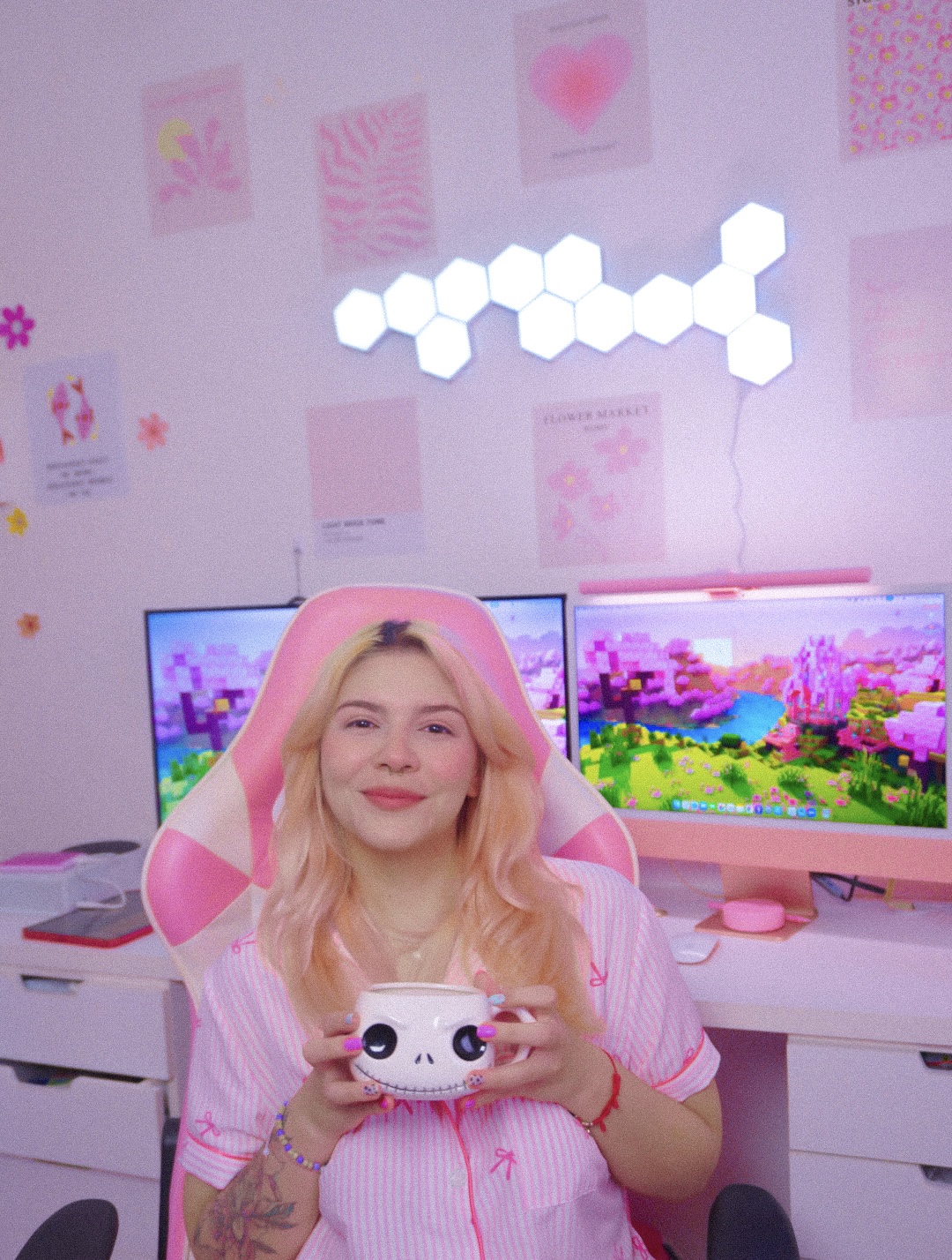 Andrea Garcia, creator of My Pink Korner, sitting at her pink gaming setup